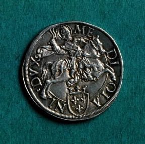 Berlinga . Verso della lira milanese in argento del sec. XVI recante l'immagine di S. Ambrogio a cavallo.Milano, M. Castello