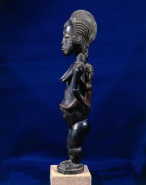 BaulÃ© . Figurina in legno con tatuaggi tribali a cheloidi (Parigi, MusÃ©e des Arts Africains et Oceaniens).De Agostini Picture Library/ G. Dagli Orti
