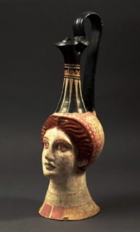 Magna Grecia. LekÃ½thos a testa di donna in terracotta dipinta (Bari, Museo Archeologico).De Agostini Picture Library/G. Dagli Orti