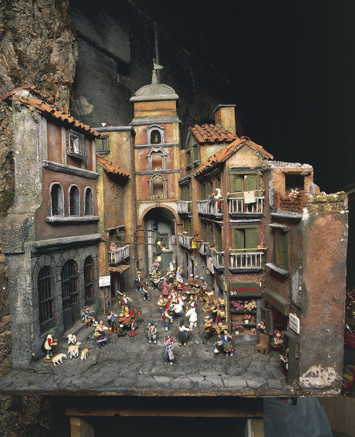 Presepe napoletano con la riproduzione di San Gregorio Armeno a Napoli con l'Arco di San Lorenzo Maggiore Per realizzare i presepi napoletani agli artisti più noti (Celebrano, Somma, Sanmartino, Vaccaro a Napoli; Maragliano, Pittaluga a Genova; Matera in Sicilia) si affiancò una schiera di artigiani per l'esecuzione delle figure, per lo più intagliate in legno con teste, mani e piedi in terracotta, e della ricchissima suppellettile (vestiti, gioielli, arredi, finimenti ecc.).